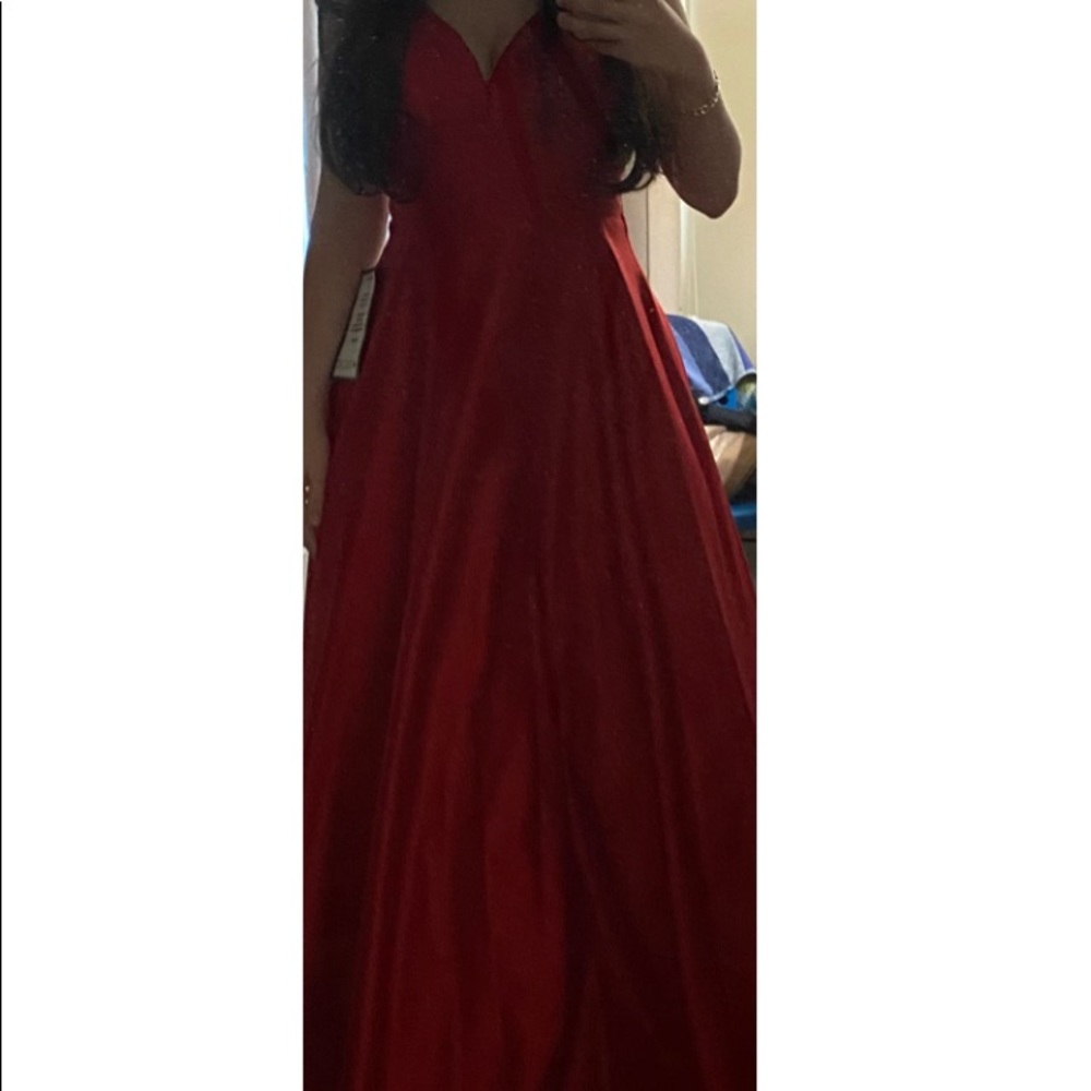 Long red prom dress from Macy’s bought it for $250selling it for $120.Size 2